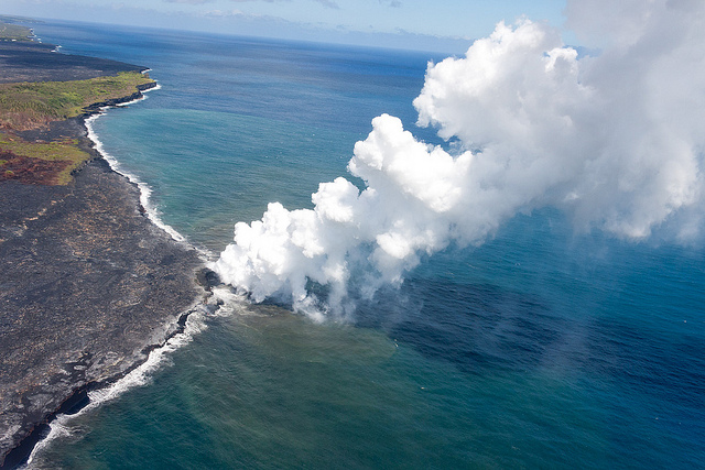 Vog plume where lava flows into the ocean